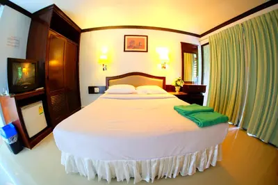 a bedroom with a large bed in a room at P.K. Mansion in Ao Nang Beach