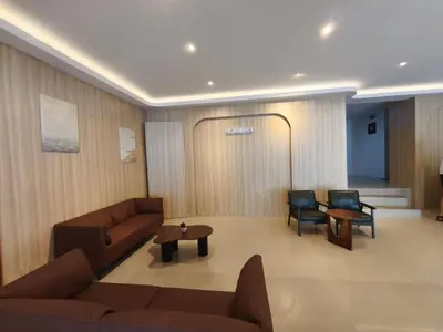 a living room with a couch and chairs and a table at P.K. Mansion in Ao Nang Beach