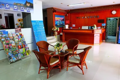 a pharmacy with chairs and a table in a store at P.K. Mansion in Ao Nang Beach