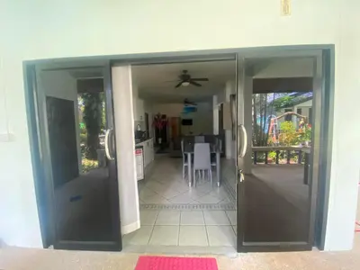 an open door to a kitchen and a dining room at Sabai Resort in Ao Nang Beach