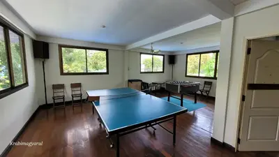 a living room with a ping pong table in it at Sabai Resort in Ao Nang Beach