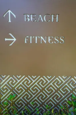 a sign with the words beach fitness on it at Baan Mai Khao in Mai Khao Beach