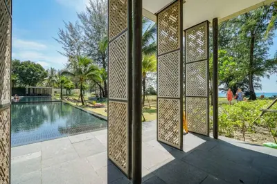 an entrance to a villa with a swimming pool at Baan Mai Khao in Mai Khao Beach