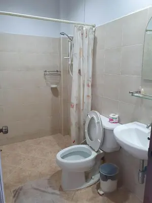 a bathroom with a toilet and a sink at Groovy Bungalows in Ao Nang Beach