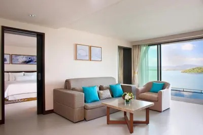 a living room with a couch and a table at The Westin Siray Bay Resort & Spa, Phuket in Phuket Town