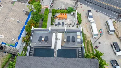 an overhead view of a building with a swimming pool at See Sea Villa Phuket SHA in Patong Beach