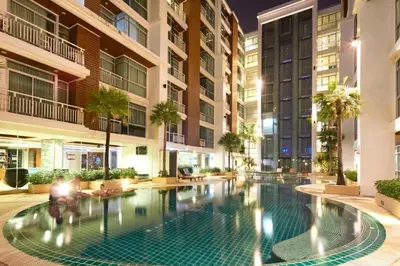 a swimming pool in the middle of a building at Art Patong Residence in Patong Beach