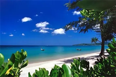 a view of a beach with boats in the water at Art Patong Residence in Patong Beach