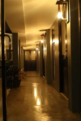 a hallway of a building with lights on the ceiling at Baan Paea Guest House in Ban Ket Ho