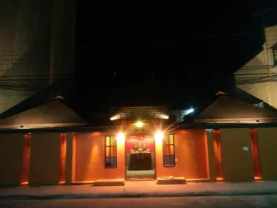 a building with lights on it at night at Baan Paea Guest House in Ban Ket Ho