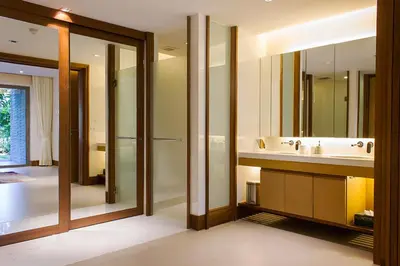 a bathroom with a sink and a mirror at Nai Thon Beachfront Apartments in Nai Thon Beach