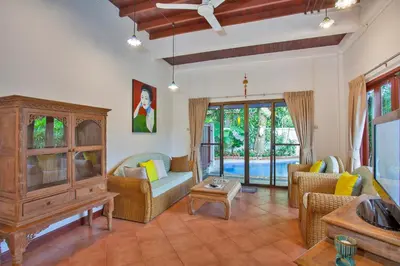 a living room with a couch and chairs at Traditional Thai Villa Nikkie in Tropical Nature, 4BR & Pool, near Rawai Beach in Nai Harn Beach