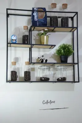 a shelf with jars and plants on it at Casa Jip Guesthouse in Patong Beach