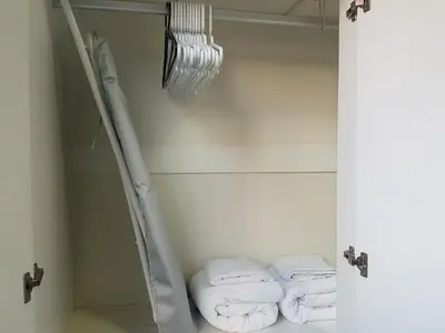 a bathroom with three folded towels on a shelf at Dcondo Kathu Patong Phuket by Suna in Kathu