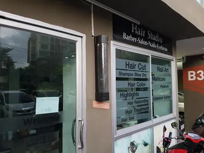a store with signs on the side of a building at Dcondo Kathu Patong Phuket by Suna in Kathu