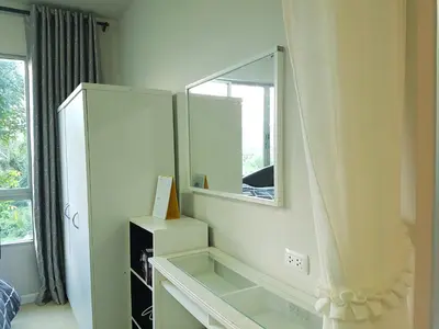 a bathroom with a mirror and a white dresser at Dcondo Kathu Patong Phuket by Suna in Kathu