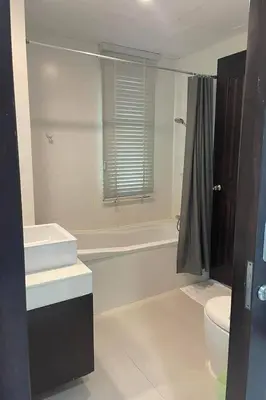 a bathroom with a tub and a toilet and a sink at Kamala Villa Hill in Kamala Beach