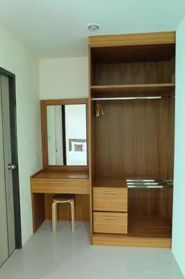 a room with a wooden closet with a mirror at DOS'S HOUSE in Nai Yang Beach