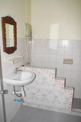 a bathroom with a sink and a mirror at Seaworld Guesthouse in Ao Nang Beach