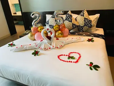 a bed with a bunch of balloons and hearts on it at Karon Sea View Beach Apartment in Karon Beach