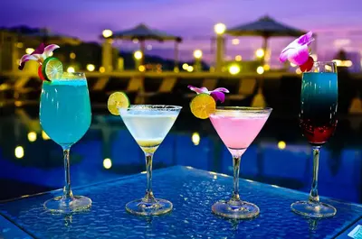 a group of four cocktails sitting on a table at ASHLEE Heights Hotel Patong in Patong Beach