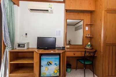 a room with a fish tank and a desk at Andaman Sea Patong in Patong Beach