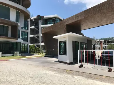 a building with a gate in front of it at Супер апартаменты Найтон Naithon in Nai Thon Beach