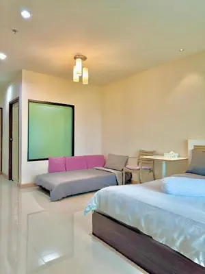a bedroom with two beds and a flat screen tv at Супер апартаменты Найтон Naithon in Nai Thon Beach