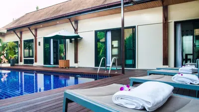 a villa with a swimming pool and two beds at VILLA Atarata Private Pool Nai Harn Beach in Rawai Beach