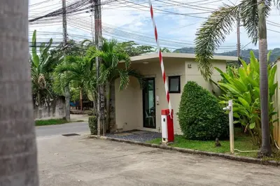 a small house with a red pole in front of it at VILLA Atarata Private Pool Nai Harn Beach in Rawai Beach