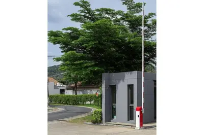a building with a red fire hydrant next to a street at VILLA AWA Private Pool Naiharn beach in Rawai Beach