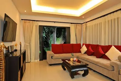 a living room with a couch and a table at VILLA Emauha Pool Thaimond Residence Naiharn in Rawai Beach