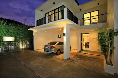 a car parked in the driveway of a house at VILLA Emauha Pool Thaimond Residence Naiharn in Rawai Beach