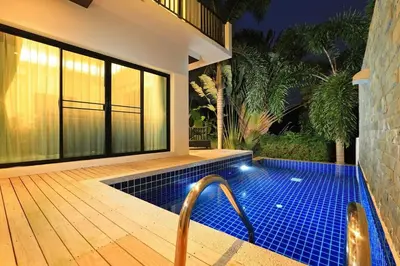 a swimming pool in the middle of a house at VILLA Emiemi Pool Thaimond Residence Naiharn in Rawai Beach