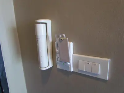 a nintendo wii controller hanging on a wall at The Front Hotel and Apartments in Patong Beach