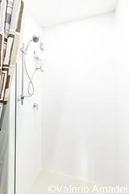 a bathroom with a shower and a sink at Ozone Condotel Kata Beach by PHR in Kata Beach