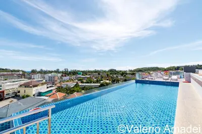 a swimming pool on the roof of a building at Ozone Condotel Kata Beach by PHR in Kata Beach