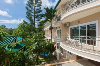 an aerial view of a house with a balcony at Patong Rai Rom Yen Resort SHA in Patong Beach