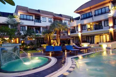 a hotel with a swimming pool in front of a building at P.P. Palmtree Resort in Phi Phi Don