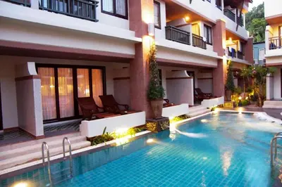 a swimming pool in front of a building at P.P. Palmtree Resort in Phi Phi Don