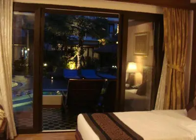 a room with a bed and a window with a view at P.P. Palmtree Resort in Phi Phi Don
