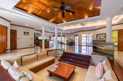 a living room with a couch and a ceiling fan at Amber Pool Villa Your private slice of paradise in Rawai Beach