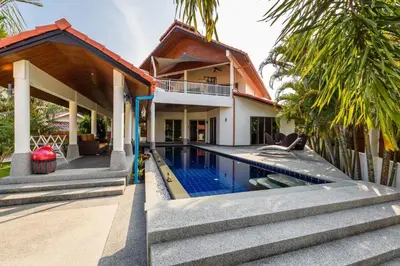 a house with a swimming pool in front of it at Amber Pool Villa Your private slice of paradise in Rawai Beach