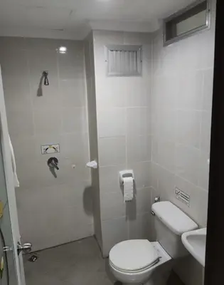 a bathroom with a toilet and a sink at DJ House ดีเจ เฮ้าท์ป่าตอง in Patong Beach