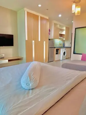 a large bed with a pillow on it in a room at Nai Thon Condo Unit in Nai Thon Beach