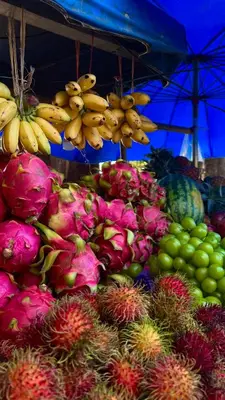 a display of fruits and vegetables in a market at Nai Thon Condo Unit in Nai Thon Beach