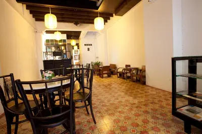 a dining room with tables and chairs in a room at 99 Oldtown Boutique Guesthouse SHA EXTRA PLUS in Phuket Town