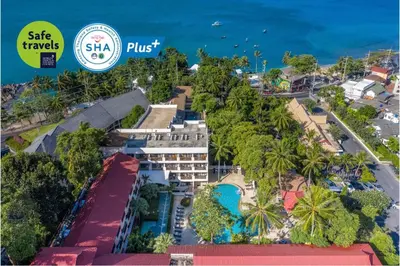 an aerial view of a resort with the ocean in the background at Patong Lodge Hotel - Thailand's Green Hotel Plus in Patong Beach