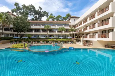 a large swimming pool in front of a building at Patong Lodge Hotel - Thailand's Green Hotel Plus in Patong Beach