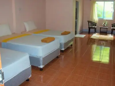 a room with two beds in a room with at D's Corner & Guesthouse in Phuket Town